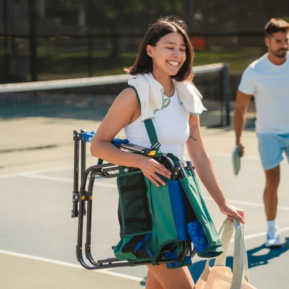 A woman carrying the pickleball stowaway rocker with a shoulder strap.