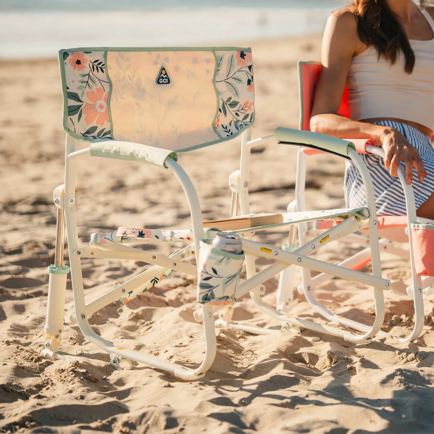 A Grab and Go Rocker floral bouqet on a sandy beach. 