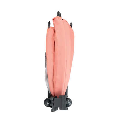 A coral Sunshade Accessory folded up. 